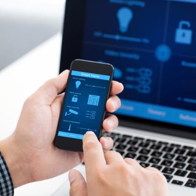 Man holding mobile phone with security app on the screen